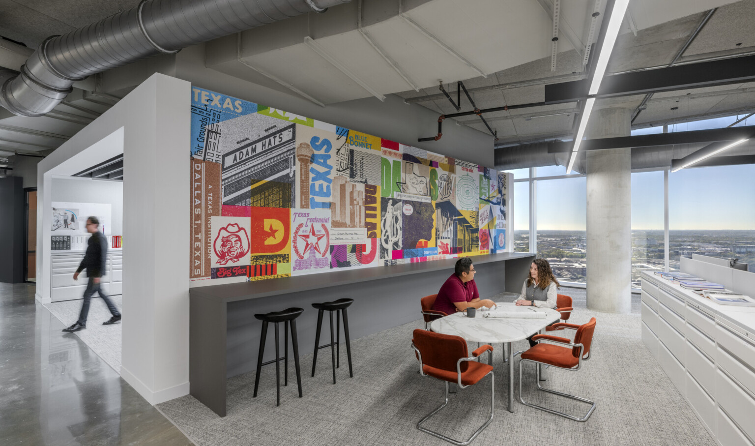 DLR Group Studio in Dallas, TX; workplace collaboration area with a full wall colorful mural