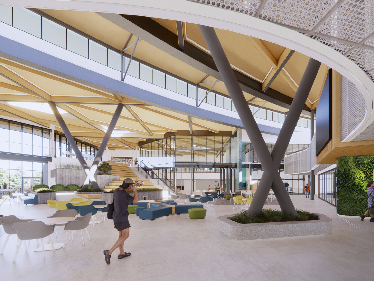 Interior double height lobby space in school. Biophilia elements, plant wall, mixed colorful seating. Mass timber wood, large windows