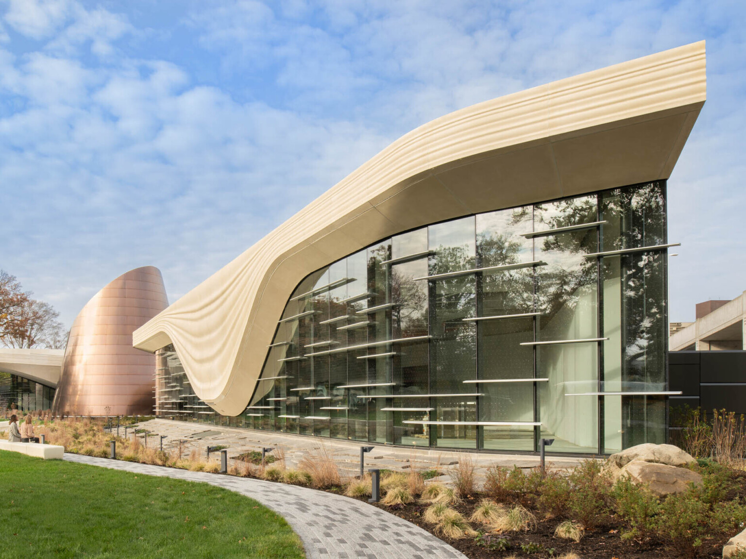 Exterior of the Cleveland Museum of Natural History showing lush grass and large window
