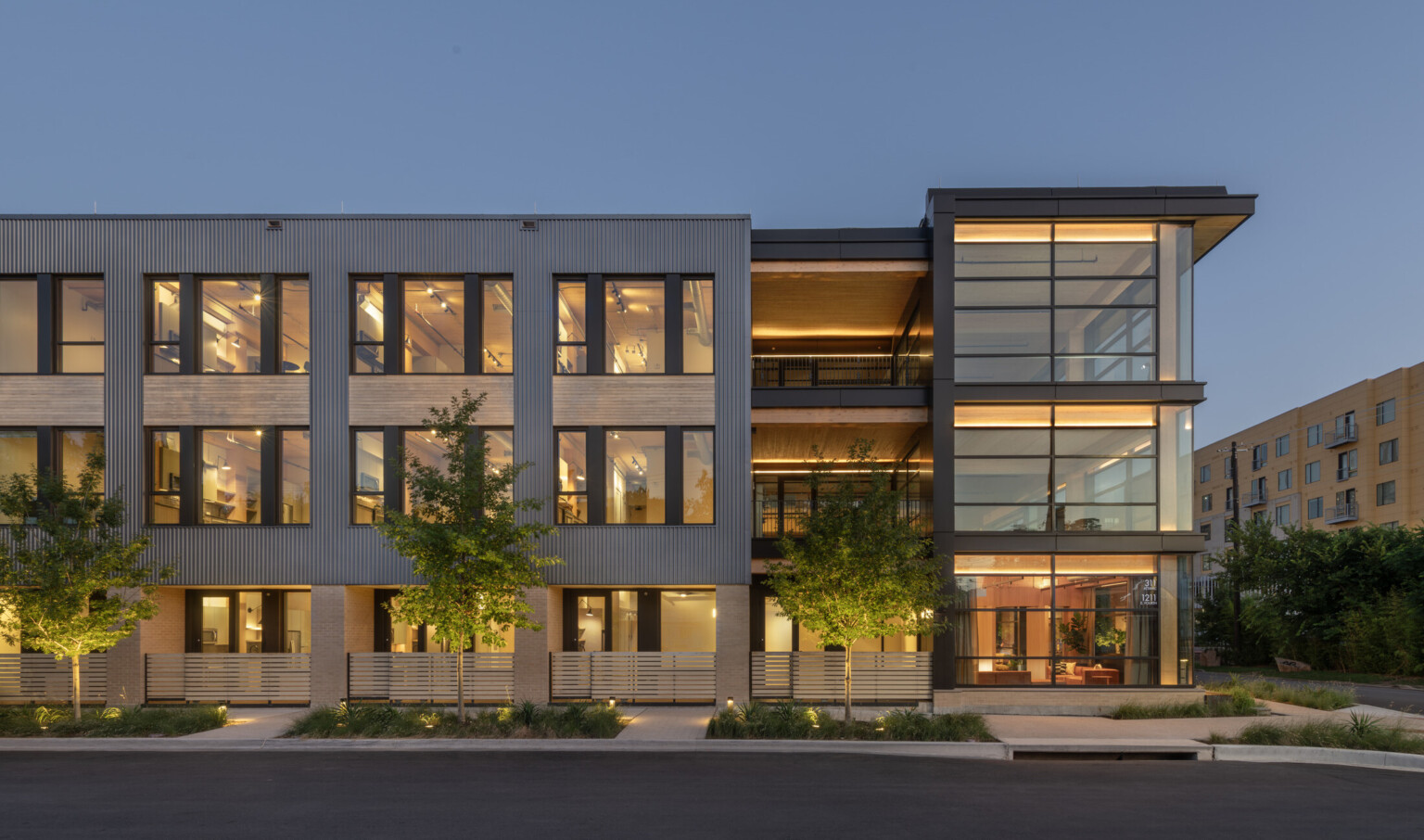 mass timber workplace and retail building with modern multi textural facades; large square and floor to ceiling windows