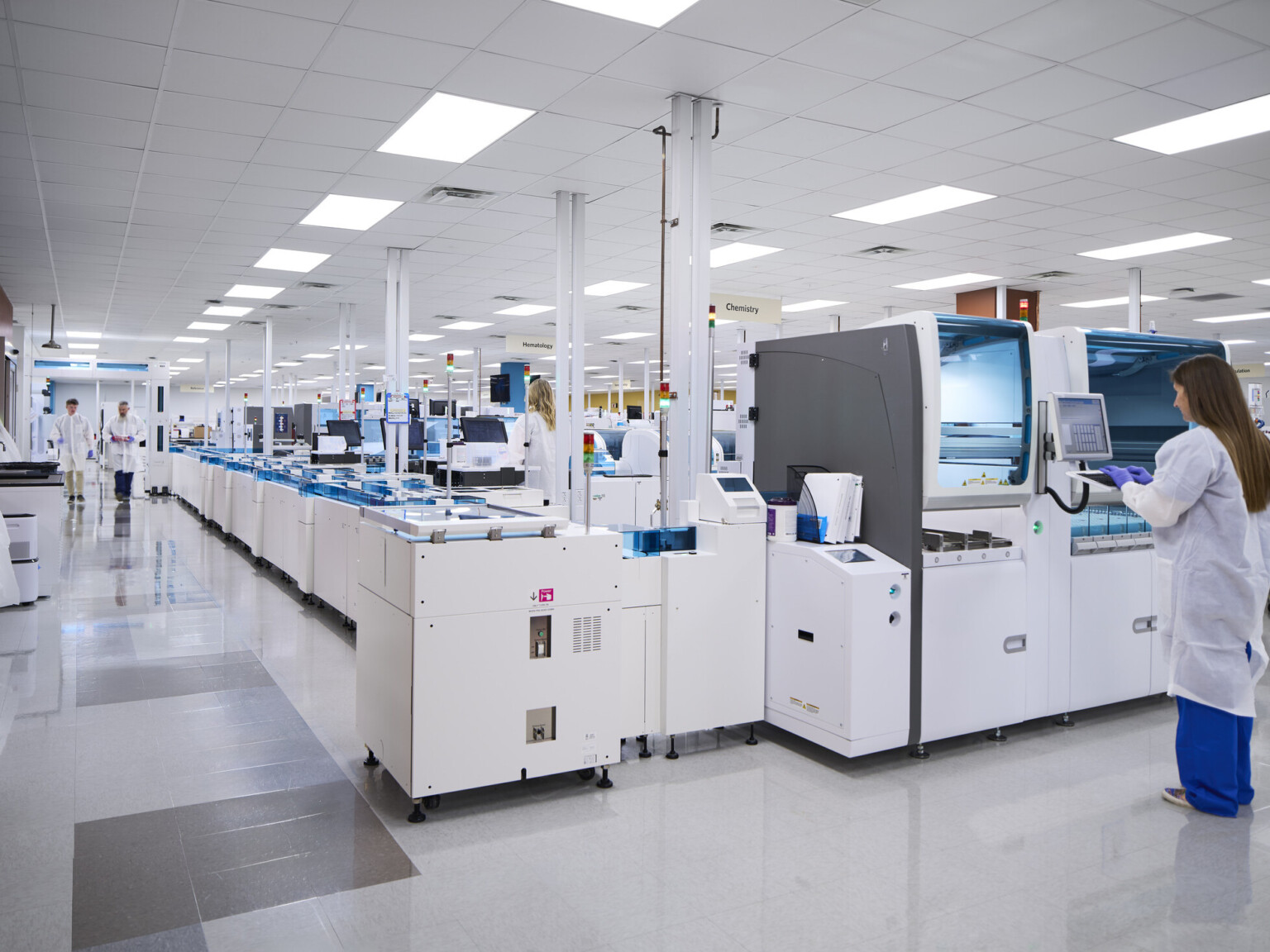 woman standing at an incubator at Vanderbilt university medical center; large state-of-the-art lab for medical teaching