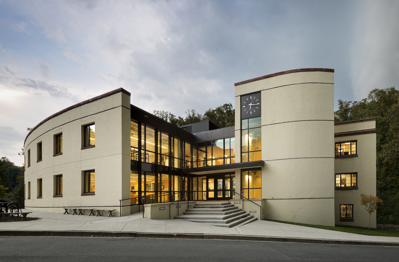 Lowell Middle Schools three-story building, concrete, tile and steel, interior floor-to-ceiling windows, cloudy skies at dusk, private schools k-12