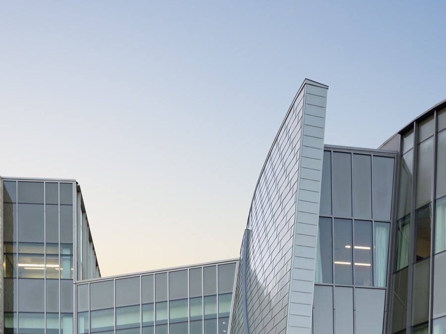 skyline of a modern healthcare building showcasing the top of the building's architecture