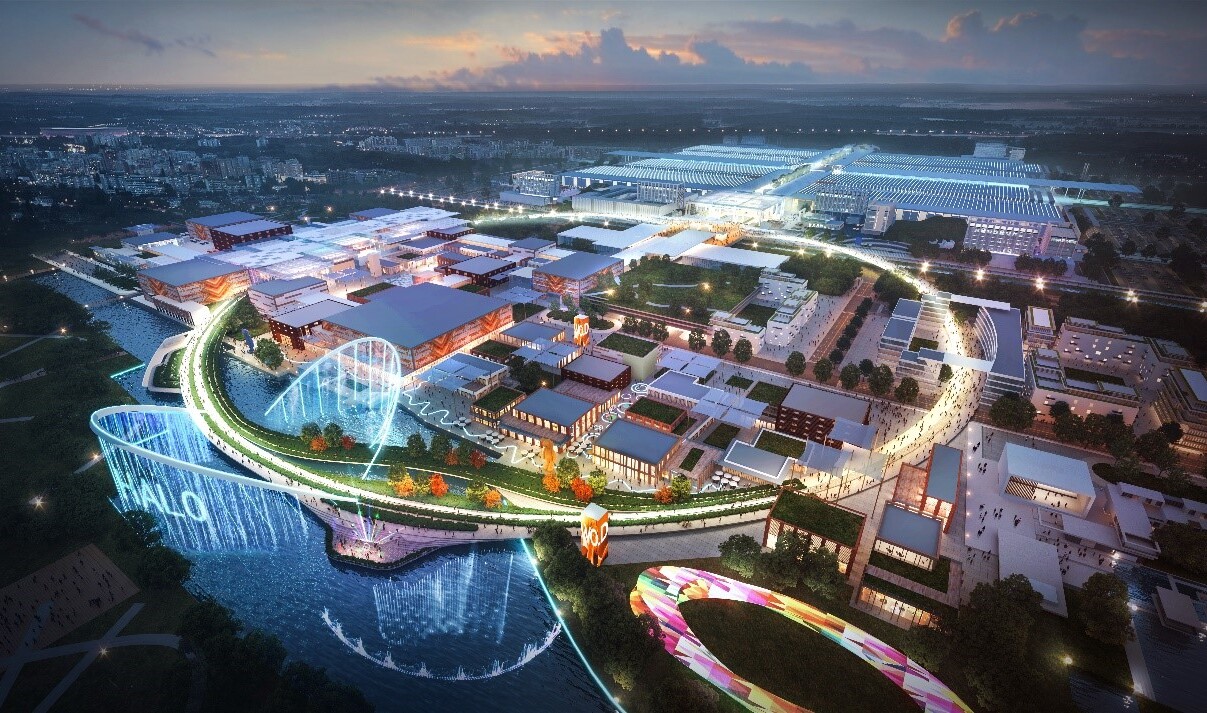 Gridded low rise city plan with illuminated buildings and green park spaces encircled by paving and green way