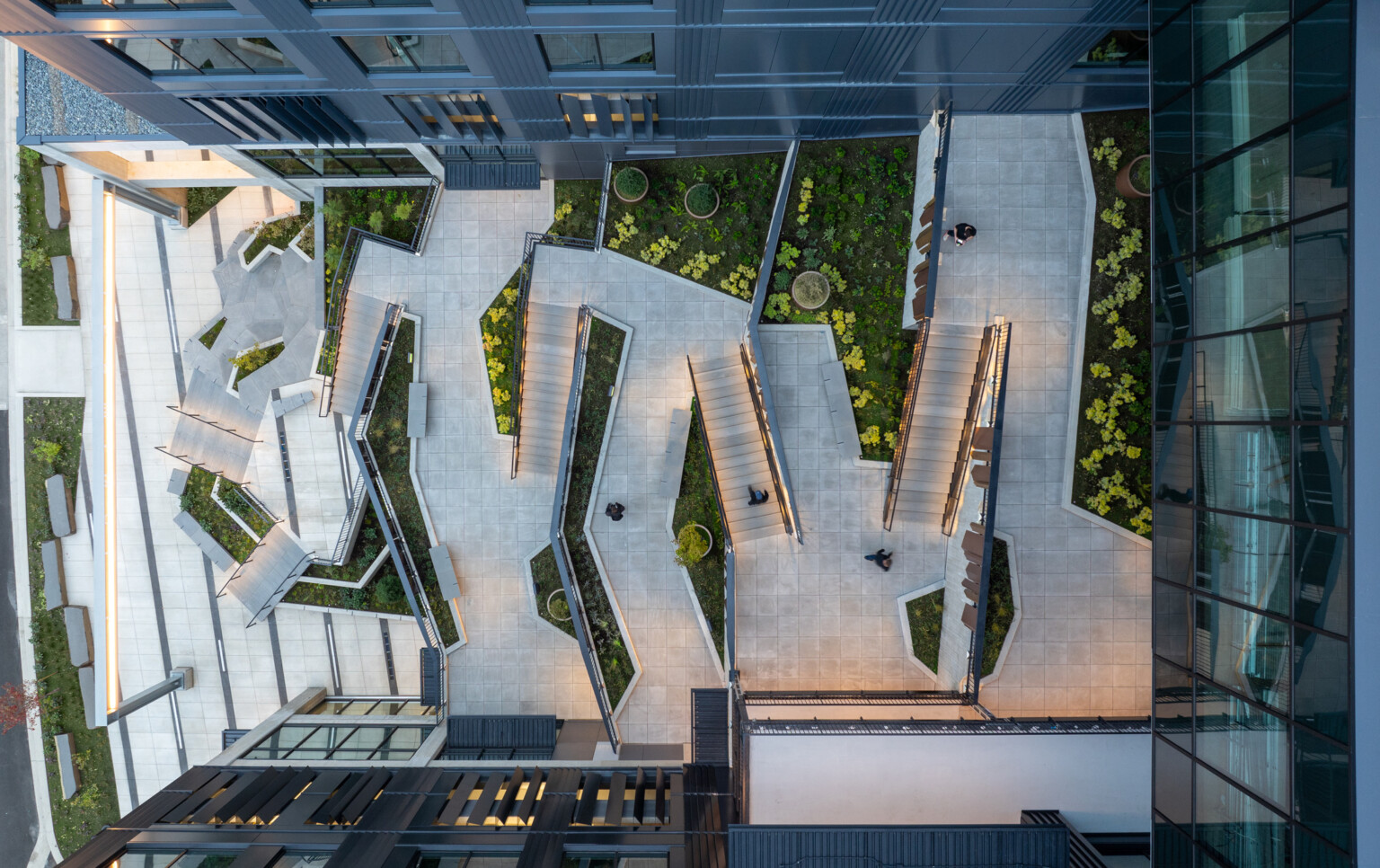 aerial view of a courtyard; zigzaging pathways create a geometric pattern