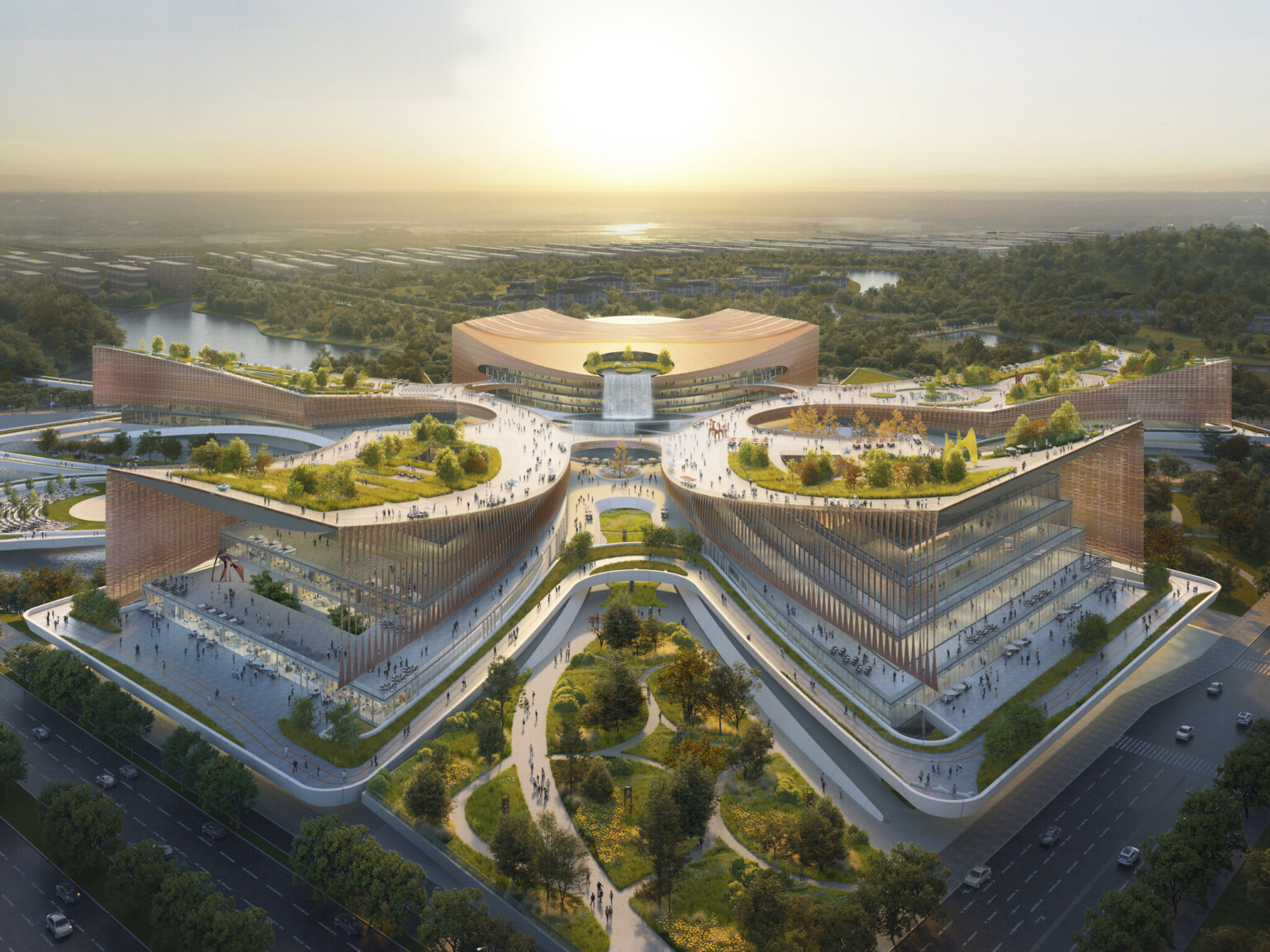 Aerial rendering of a large, modern architectural complex with multiple interconnected buildings arranged in a symmetrical, star-like pattern.
