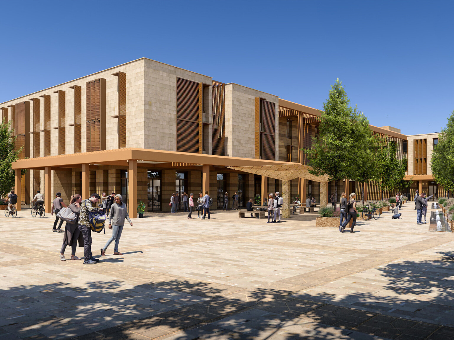 An exterior render of a modern university campus building with large windows and wooden accents. In front of the building is a spacious plaza with neatly paved walkways and several trees providing shade