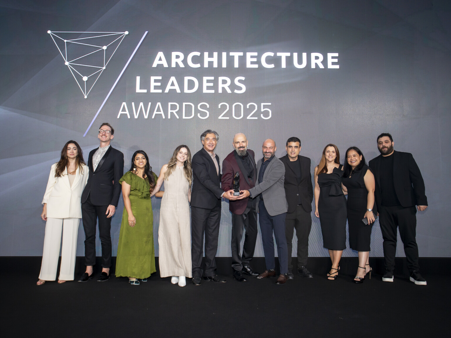 DLR Group Dubai studio receiving the award for Master Plan of the Year.